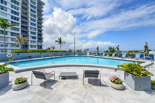 a view of a tall building with a yard