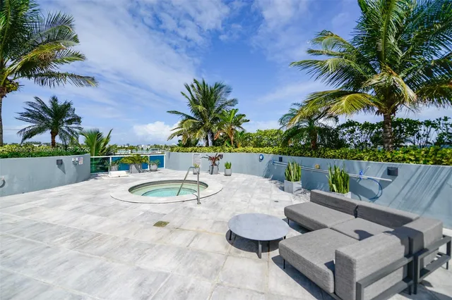 a view of a patio with a table chairs and a patio