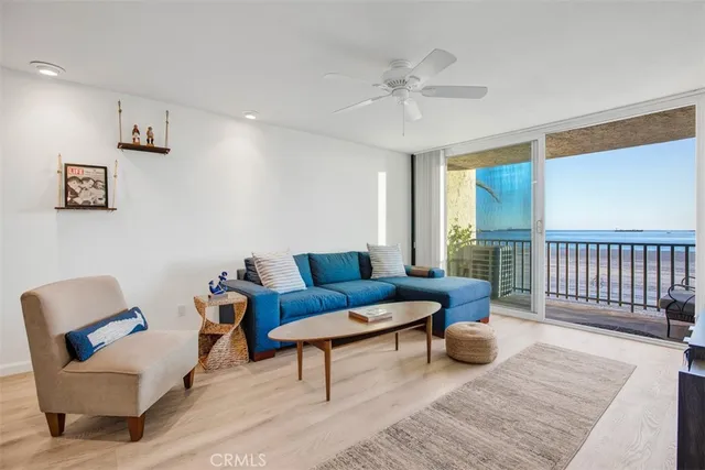 a view of a balcony with wooden floor and city view