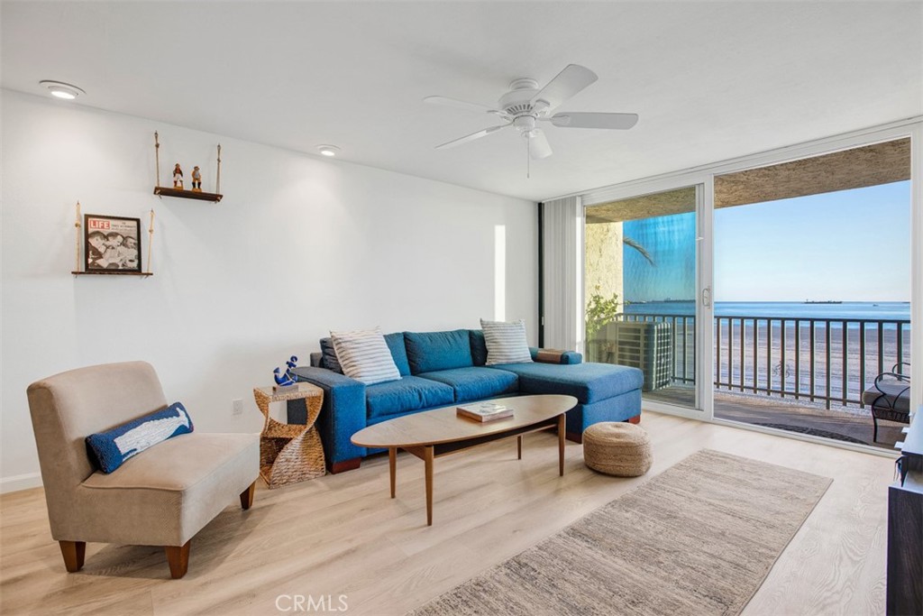 1140 East Ocean Boulevard, Unit 235 Long Beach, CA 90802 - Photo 14 of 45 a living room with furniture and a wooden floor