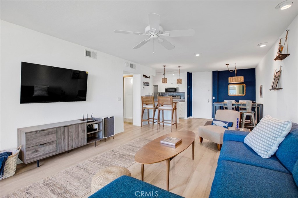 1140 East Ocean Boulevard, Unit 235 Long Beach, CA 90802 - Photo 17 of 45 a living room with furniture and a flat screen tv