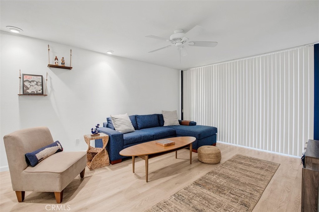 1140 East Ocean Boulevard, Unit 235 Long Beach, CA 90802 - Photo 20 of 45 a living room with furniture and a wooden floor