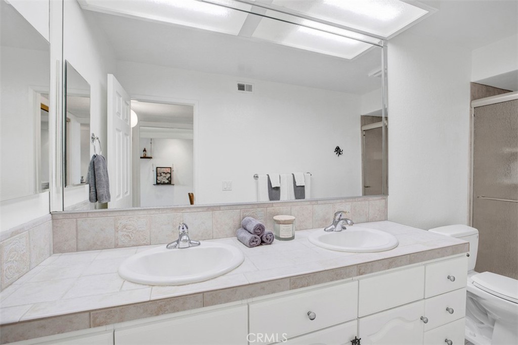 1140 East Ocean Boulevard, Unit 235 Long Beach, CA 90802 - Photo 21 of 45 a bathroom with a sink and a mirror