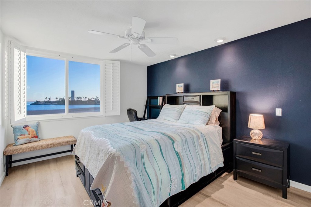 1140 East Ocean Boulevard, Unit 235 Long Beach, CA 90802 - Photo 23 of 45 a bedroom with a bed and a night stand