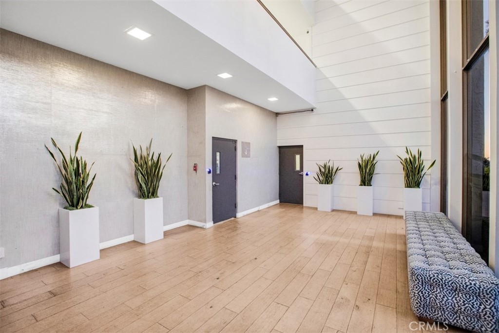 1140 East Ocean Boulevard, Unit 235 Long Beach, CA 90802 - Photo 39 of 45 a view of a hallway with potted plants