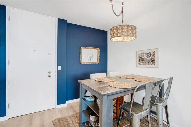 a large kitchen with kitchen island a large counter top space a sink stainless steel appliances and cabinets