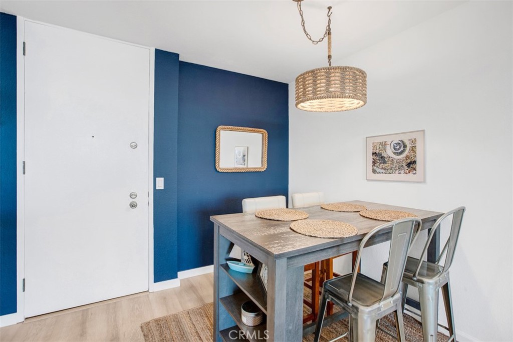 1140 East Ocean Boulevard, Unit 235 Long Beach, CA 90802 - Photo 5 of 45 a dining room with a table and chairs