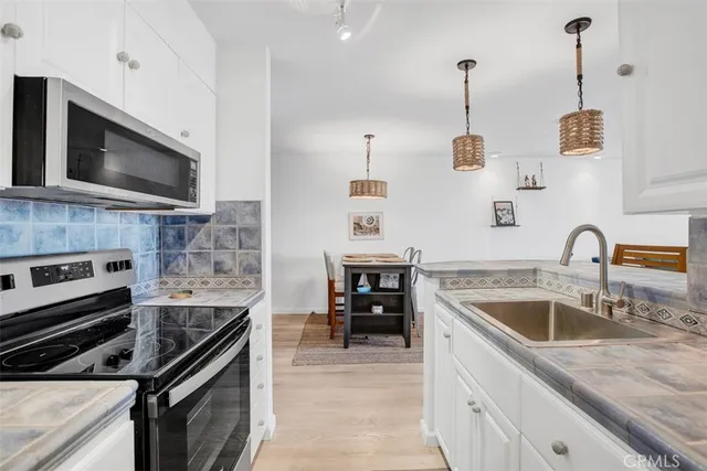 a kitchen with a stove and a microwave