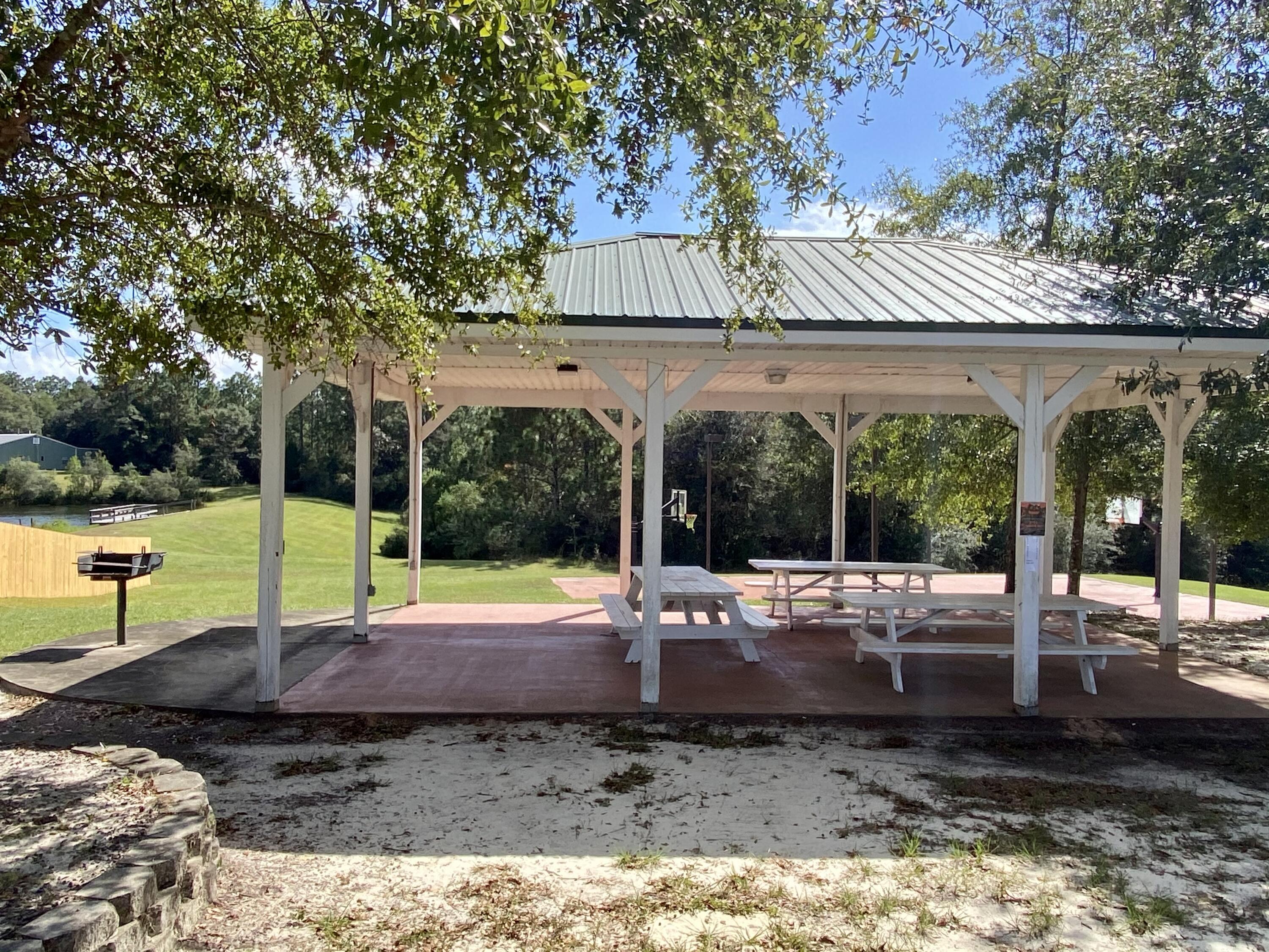 3062 Zach Avenue Crestview, FL 32536 - Photo 17 of 18 a view of a house with backyard and sitting area