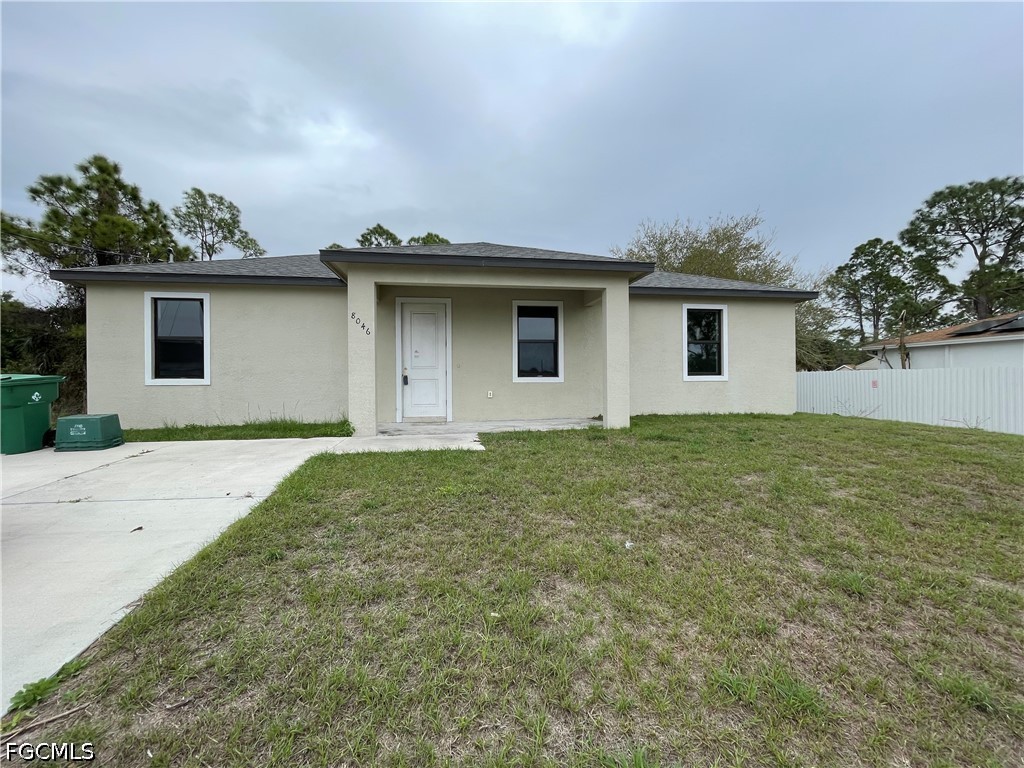 8046 Memory Circle LaBelle, FL 33935 - Photo 1 of 10 a house that has a yard