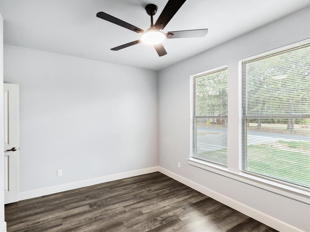 4705 Point La Vista Road Malakoff, TX 75148 - Photo 4 of 40 Wood-finish flooring with white trim
