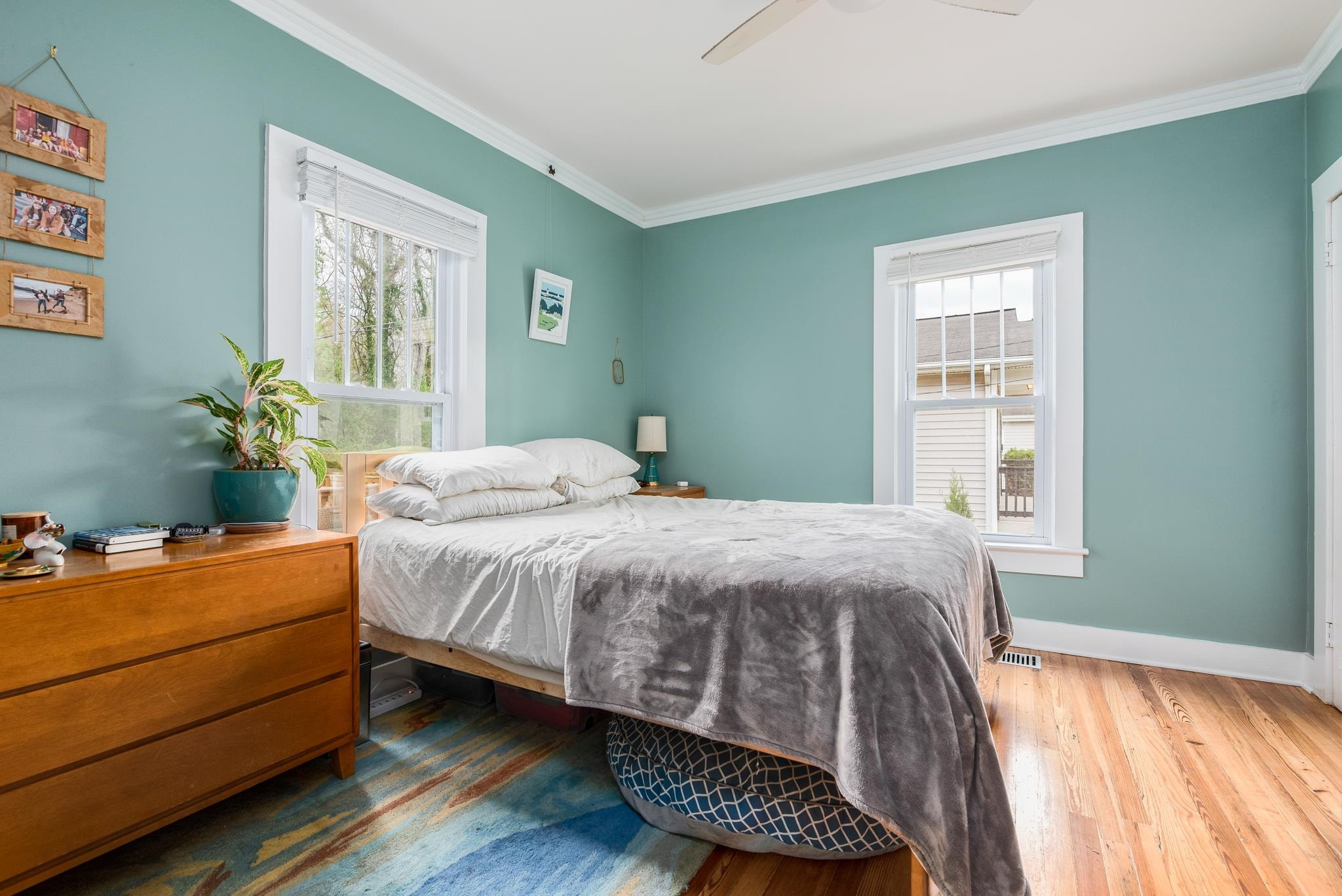 1112 Berkeley Street Durham, NC 27705 - Photo 13 of 23 a bedroom with a bed and windows
