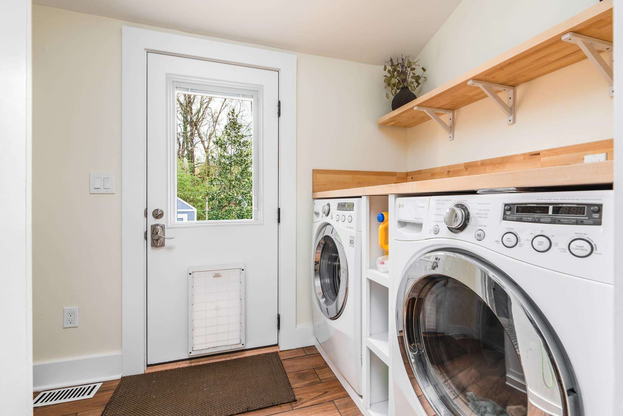 1112 Berkeley Street Durham, NC 27705 - Photo 14 of 23 a view of storage and utility room with washer and dryer