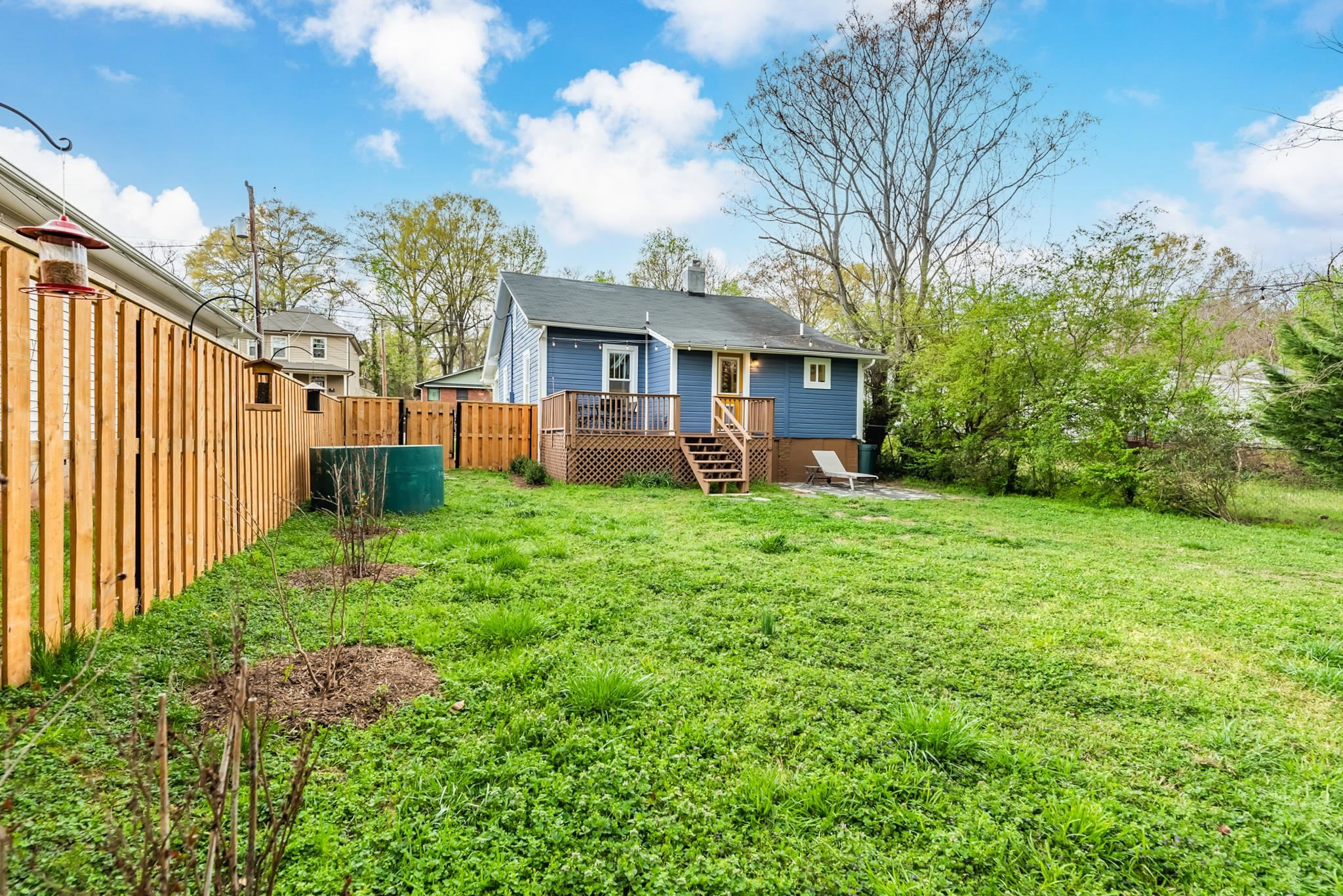 1112 Berkeley Street Durham, NC 27705 - Photo 19 of 23 a view of a house with backyard and a tree