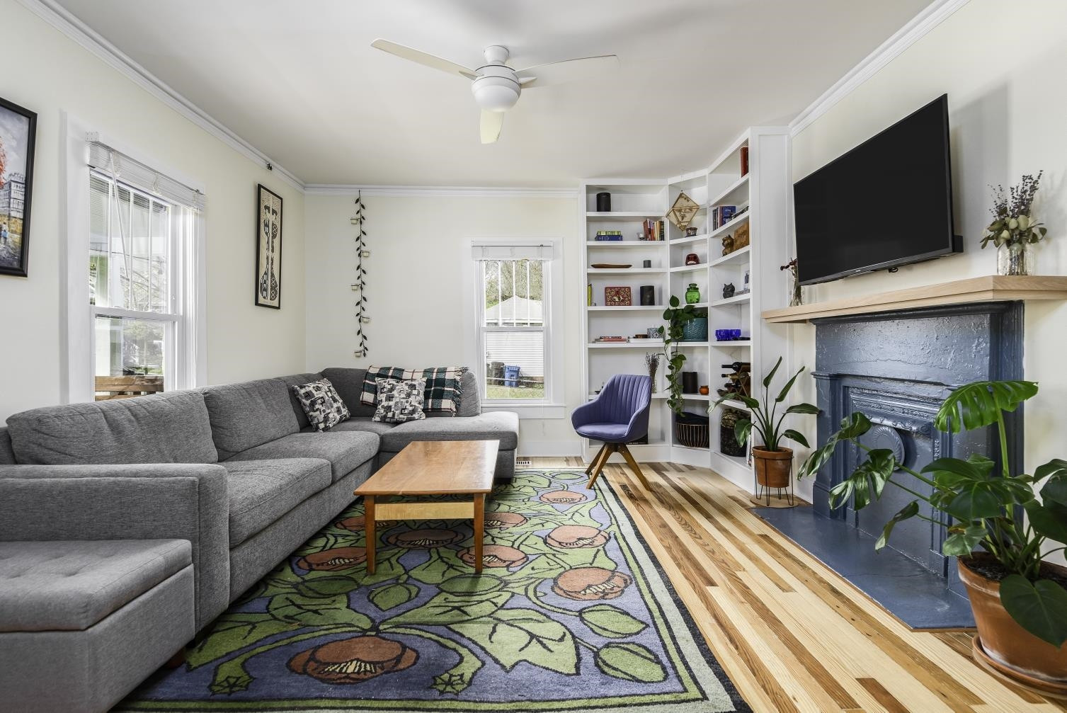 1112 Berkeley Street Durham, NC 27705 - Photo 2 of 23 a living room with furniture and a flat screen tv