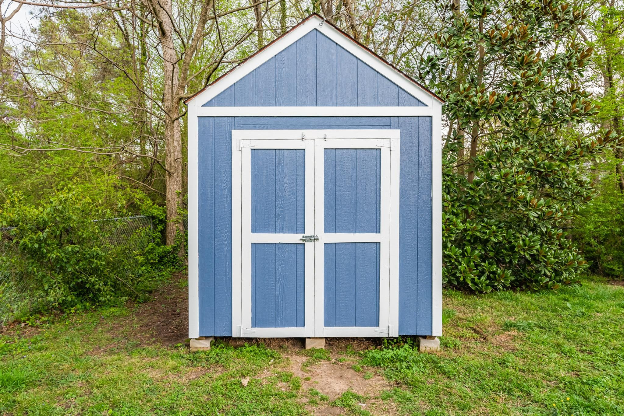1112 Berkeley Street Durham, NC 27705 - Photo 21 of 23 a view of a small house with a yard