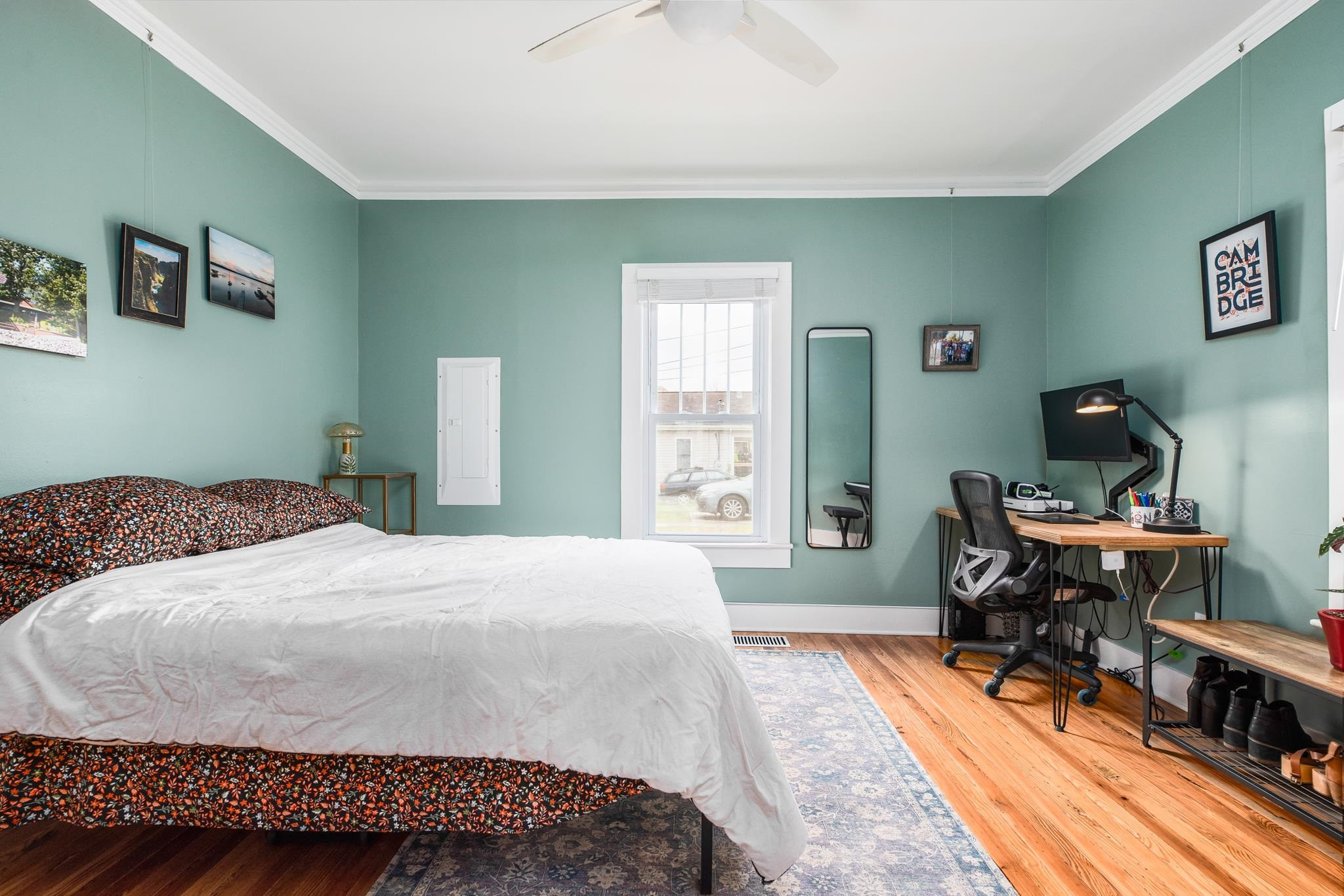 1112 Berkeley Street Durham, NC 27705 - Photo 9 of 23 a bedroom with a bed and a desk