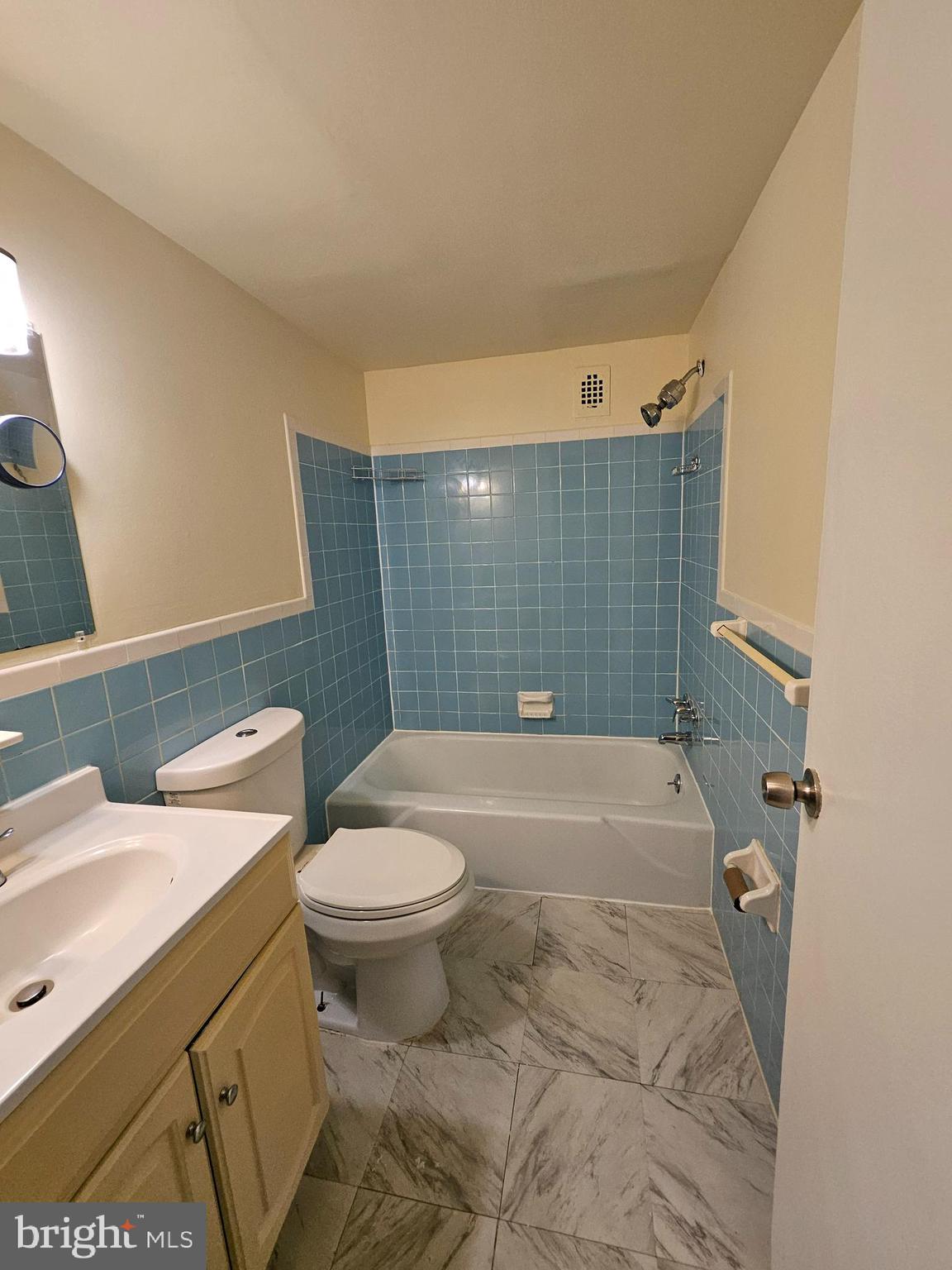 3450 Toledo Terrace, Unit 522 Hyattsville, MD 20782 - Photo 11 of 17 a bathroom with a sink a toilet and shower