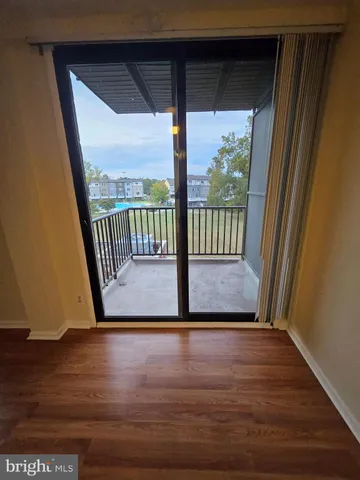 a view of porch with wooden floor