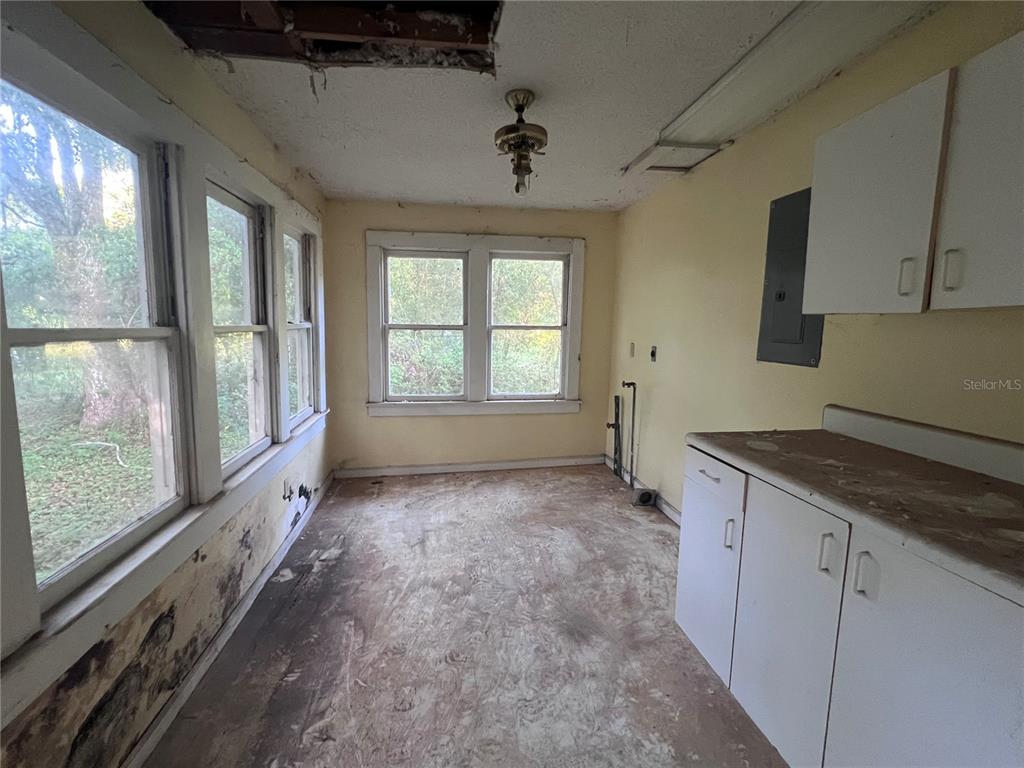 177 East 3rd Avenue Pierson, FL 32180 - Photo 16 of 16 a view of a kitchen with a sink and windows