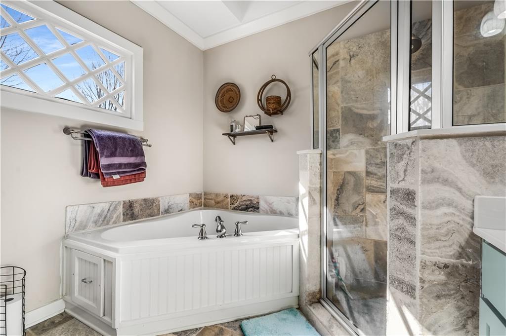 1628 Briarcliff Road Northeast, Unit 18 Atlanta, GA 30306 - Photo 14 of 25 a bathroom with a sink and a mirror