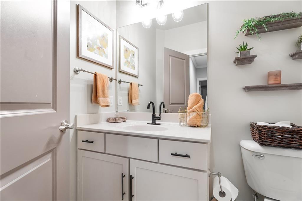 1628 Briarcliff Road Northeast, Unit 18 Atlanta, GA 30306 - Photo 18 of 25 a bathroom with a toilet sink and mirror