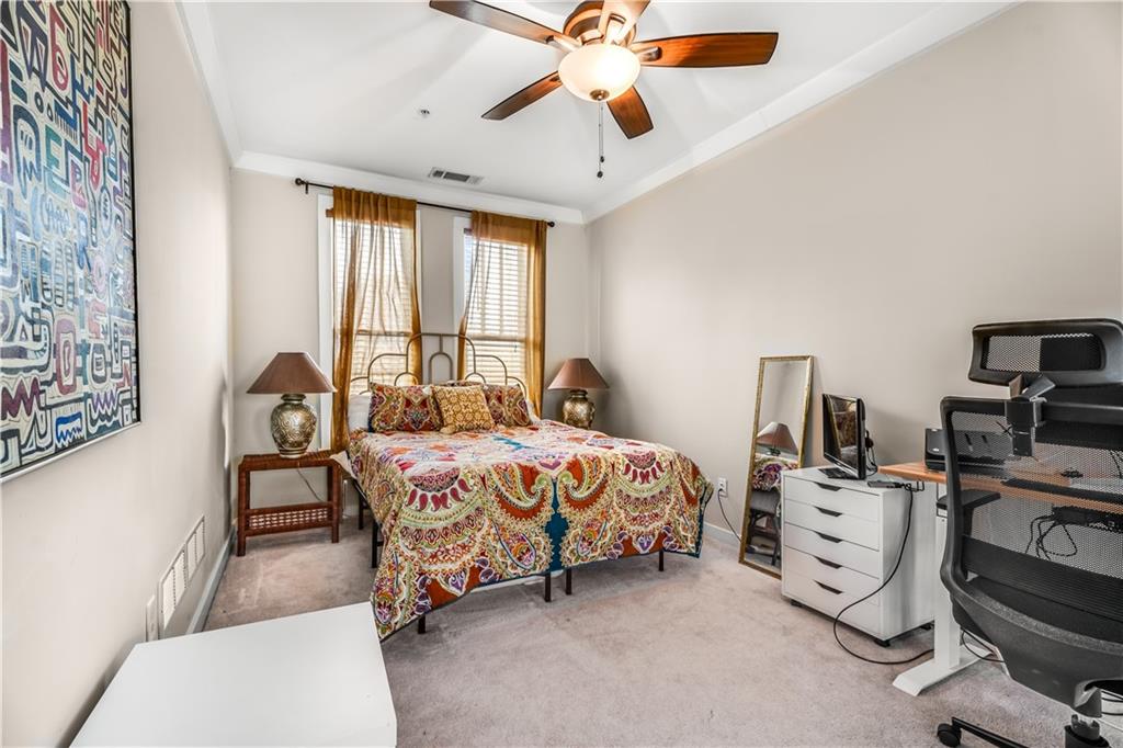 1628 Briarcliff Road Northeast, Unit 18 Atlanta, GA 30306 - Photo 20 of 25 a bed room with a bed and a window