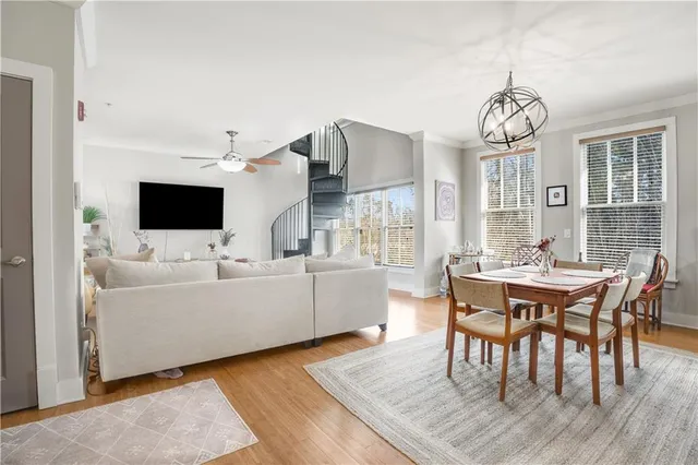 a view of a dining room with furniture and wooden floor