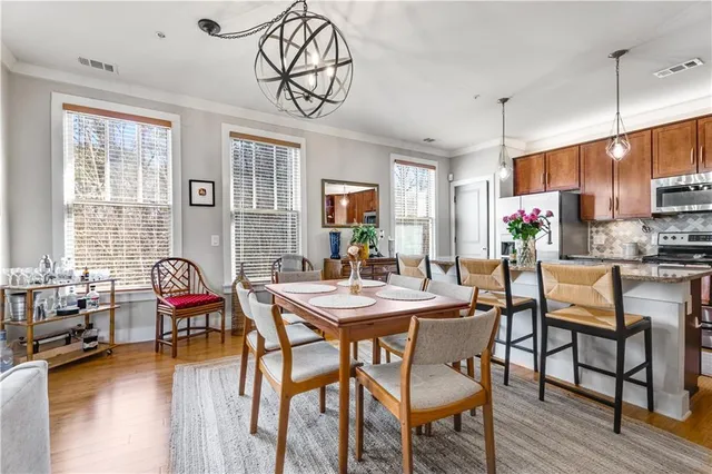 a view of a dining room with furniture window and outside view