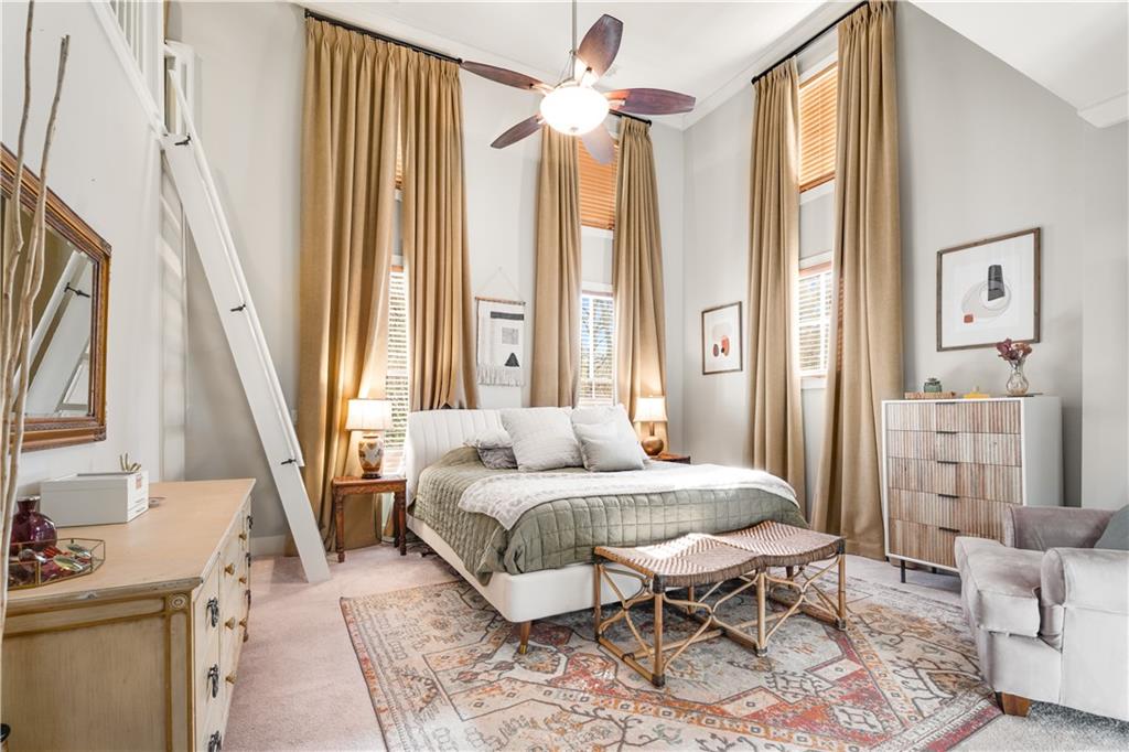 1628 Briarcliff Road Northeast, Unit 18 Atlanta, GA 30306 - Photo 9 of 25 a bedroom with a bed and a chandelier