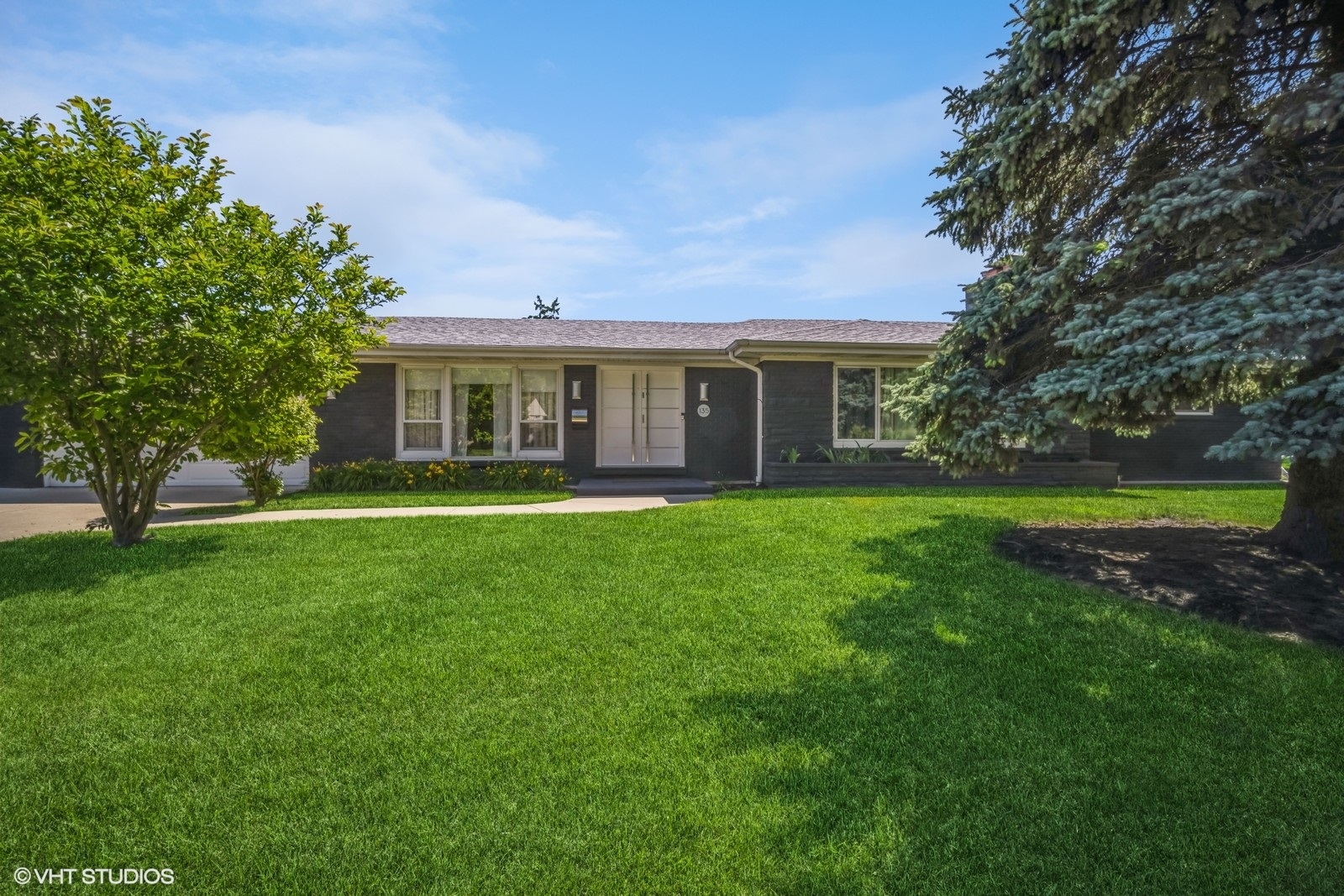 135 Birchwood Road Northbrook, IL 60062 - Photo 1 of 20 a house view with a garden space