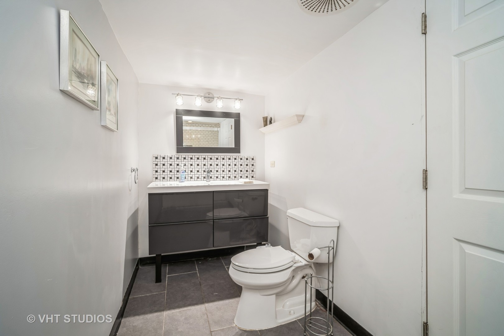 135 Birchwood Road Northbrook, IL 60062 - Photo 16 of 20 a bathroom with a toilet a sink and a window