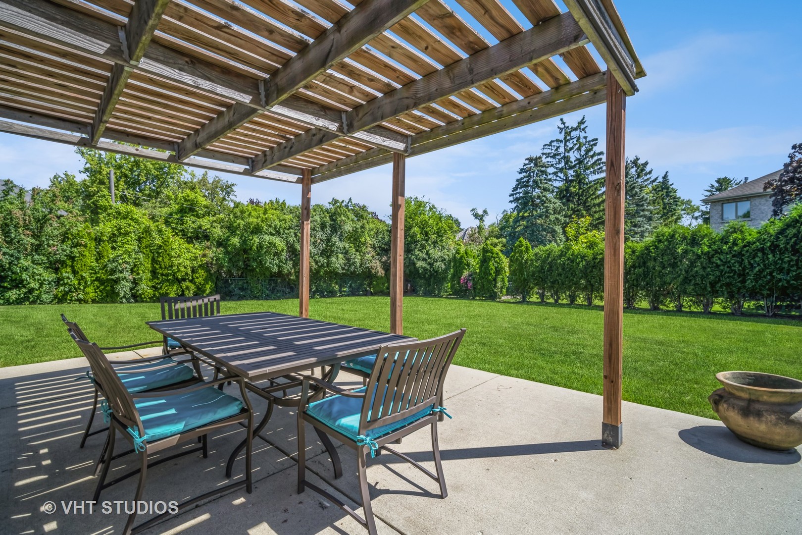 135 Birchwood Road Northbrook, IL 60062 - Photo 18 of 20 a view of patio with table and chairs under an umbrella
