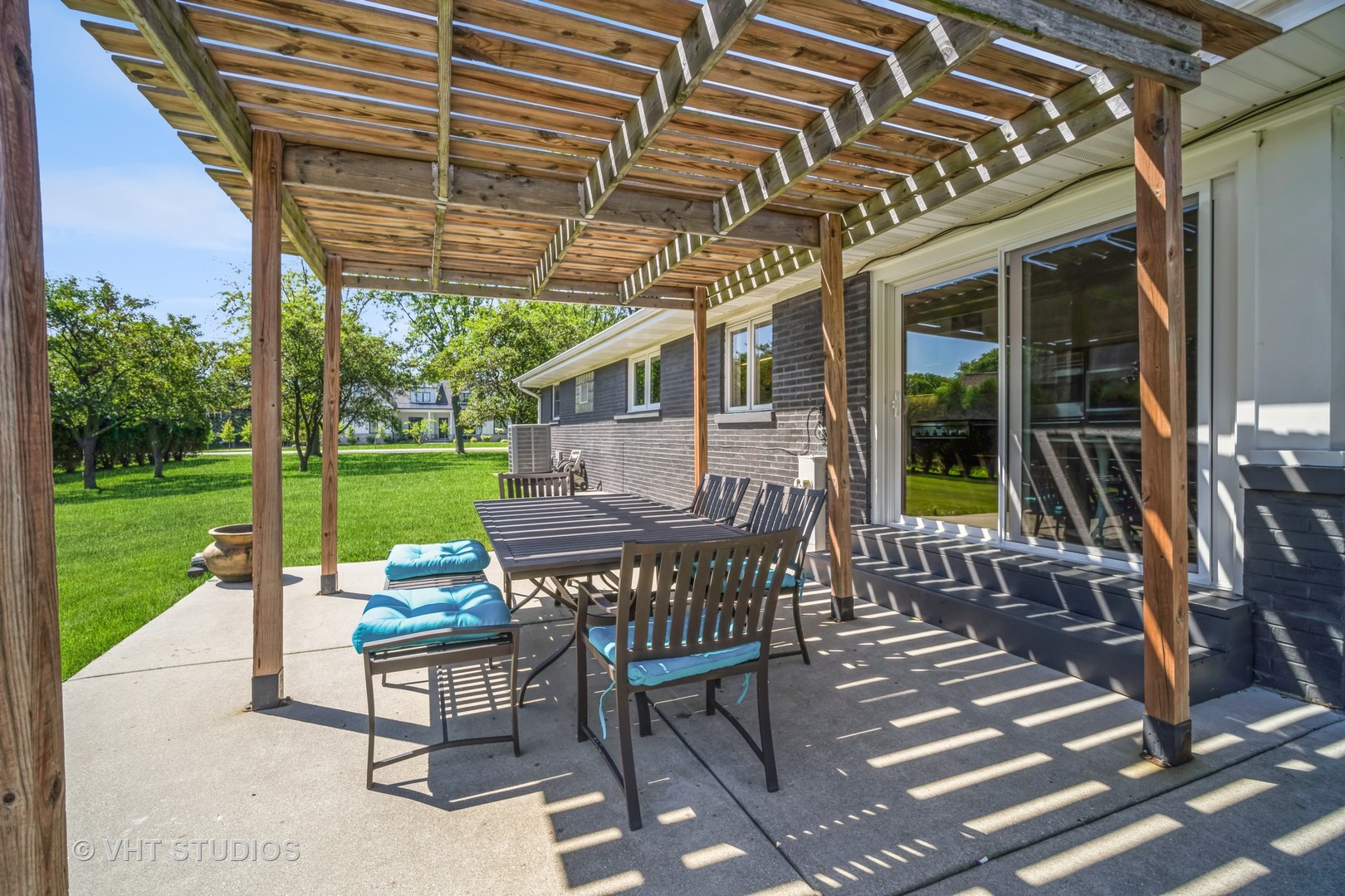 135 Birchwood Road Northbrook, IL 60062 - Photo 19 of 20 a patio with glass top table and chairs