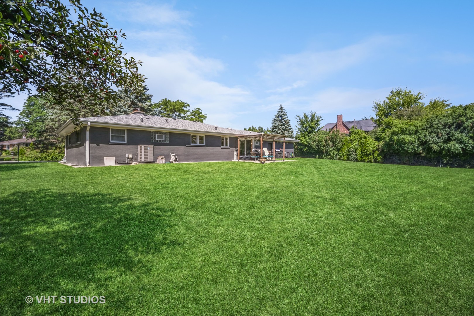 135 Birchwood Road Northbrook, IL 60062 - Photo 20 of 20 a view of a house with a yard and sitting area
