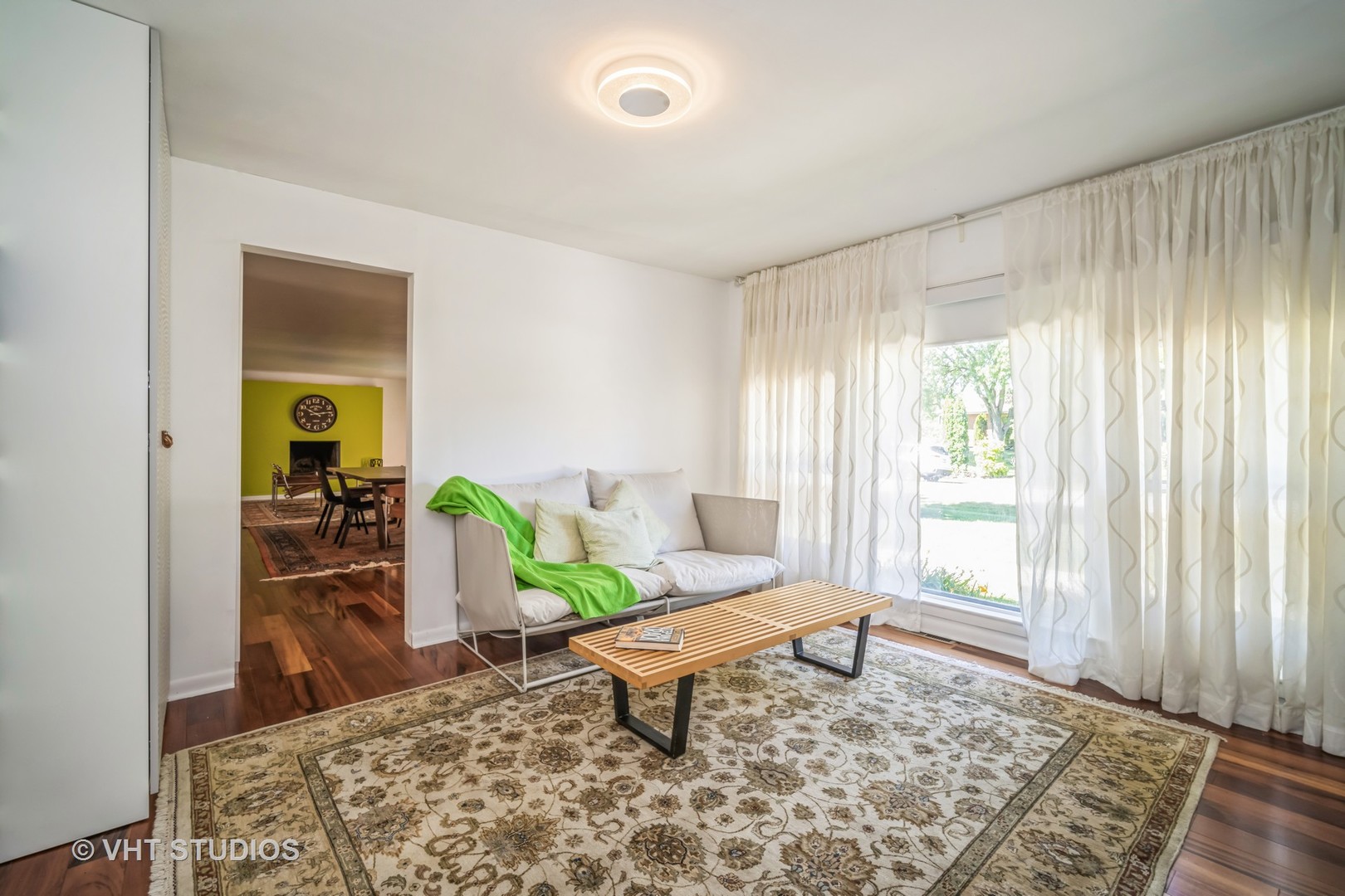 135 Birchwood Road Northbrook, IL 60062 - Photo 6 of 20 a living room with a couch and a table