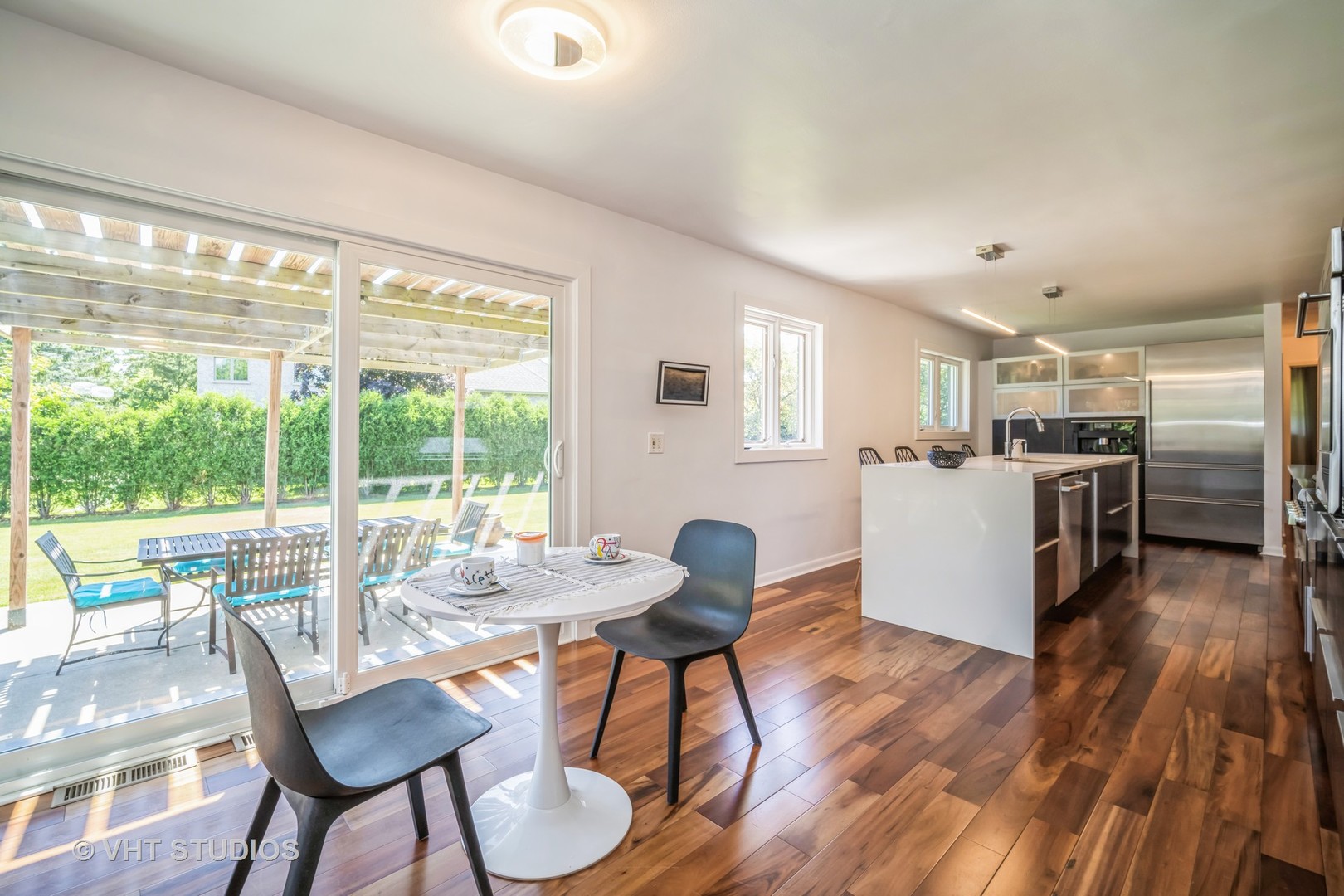 135 Birchwood Road Northbrook, IL 60062 - Photo 7 of 20 a dining room with furniture and wooden floor