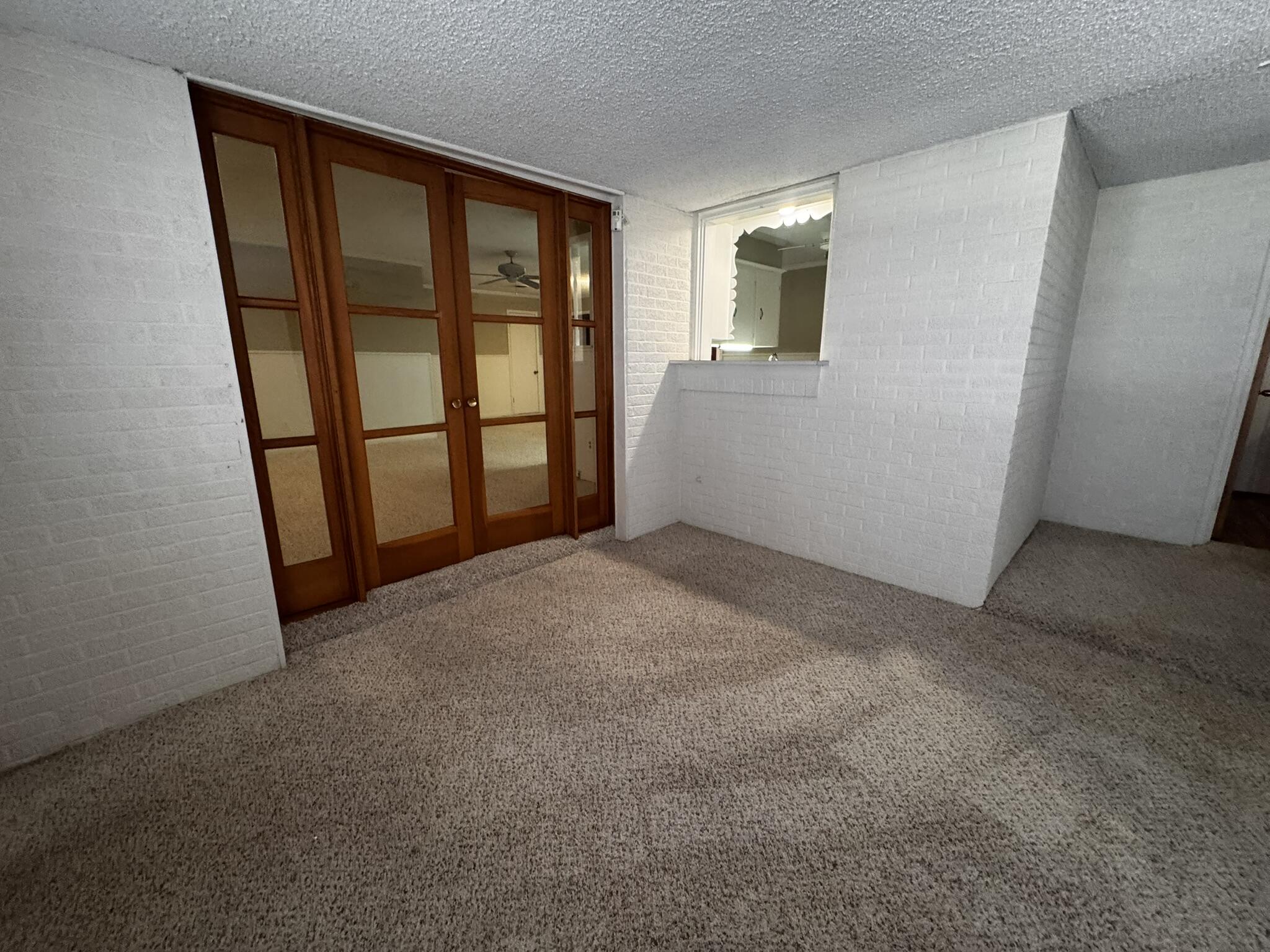 1304 Floydada Plainview, TX 79072 - Photo 14 of 49 an empty room with windows and closet