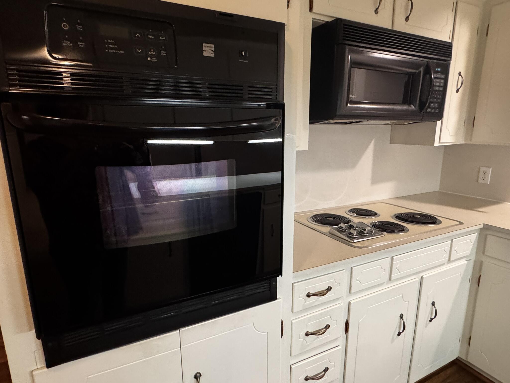 1304 Floydada Plainview, TX 79072 - Photo 16 of 49 a kitchen with granite countertop cabinets and steel stainless steel appliances