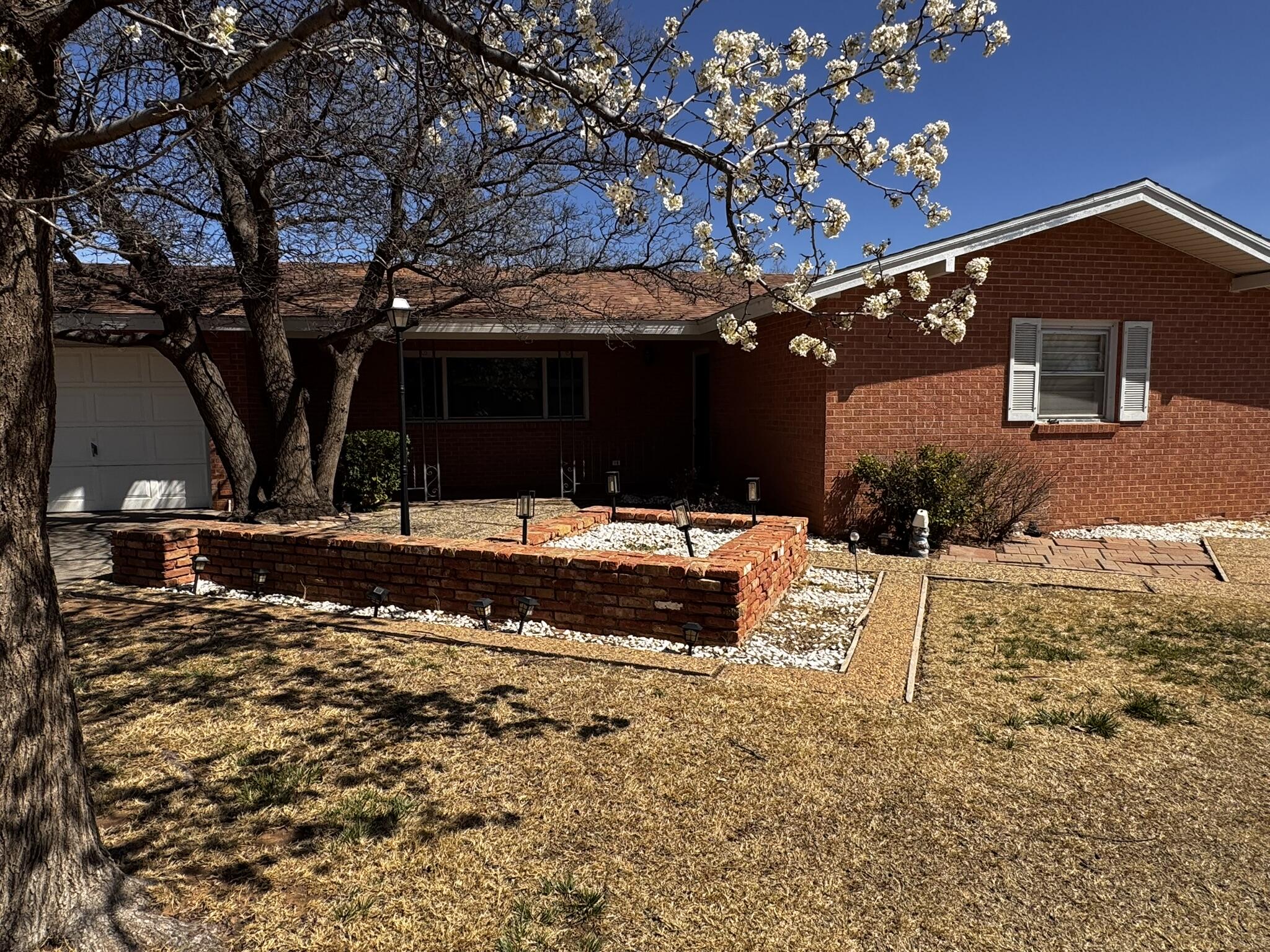 1304 Floydada Plainview, TX 79072 - Photo 2 of 49 a view of a house with a yard
