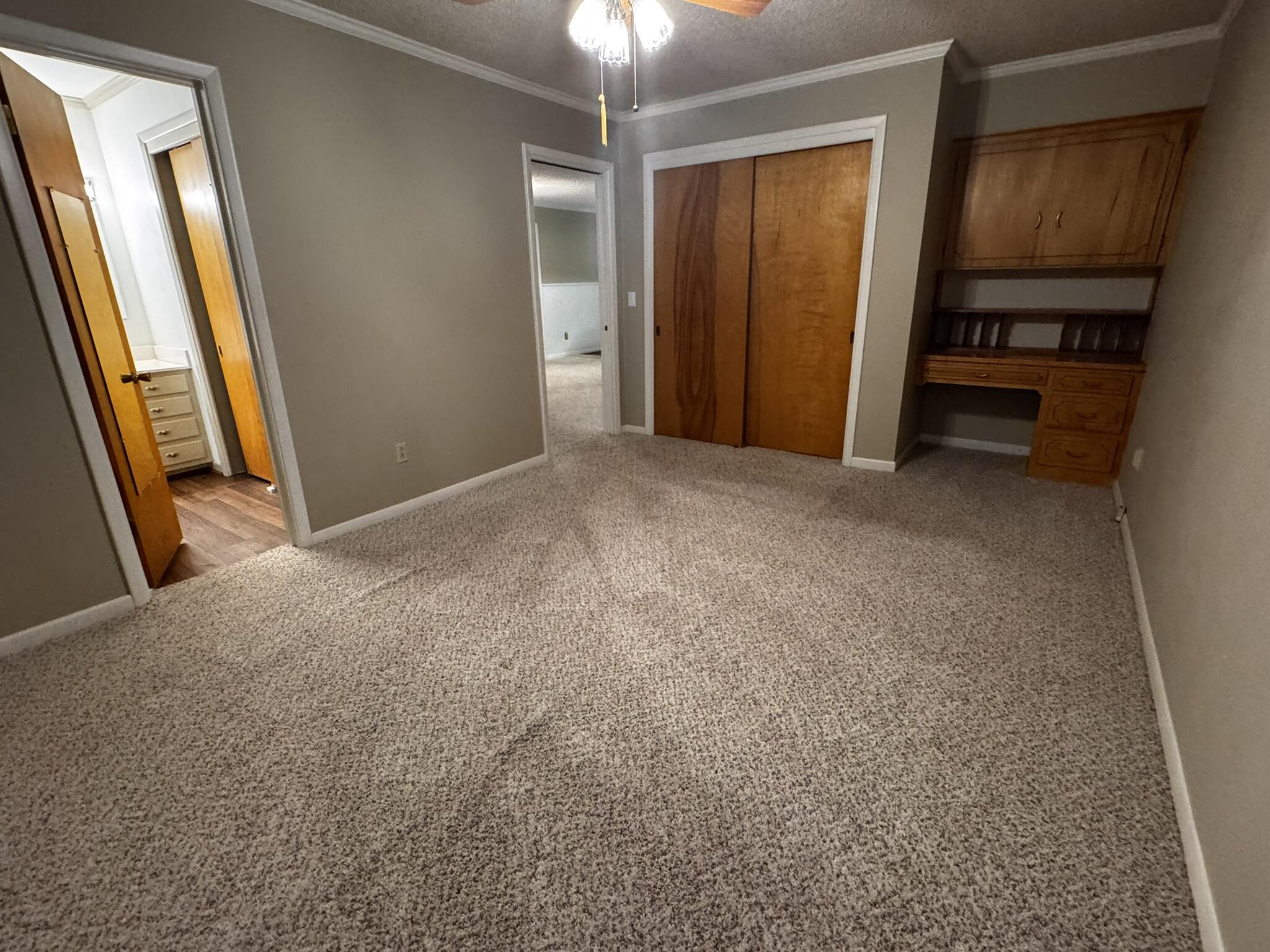 1304 Floydada Plainview, TX 79072 - Photo 22 of 49 an empty room with chandelier fan and windows