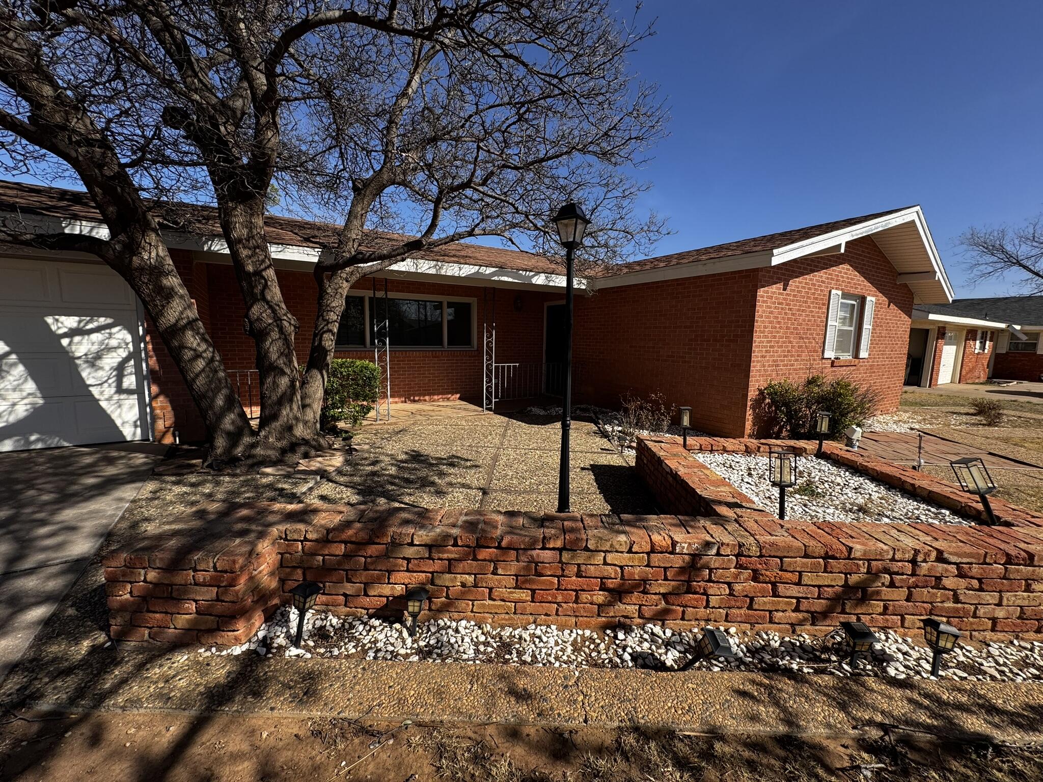 1304 Floydada Plainview, TX 79072 - Photo 3 of 49 a view of a house with a yard
