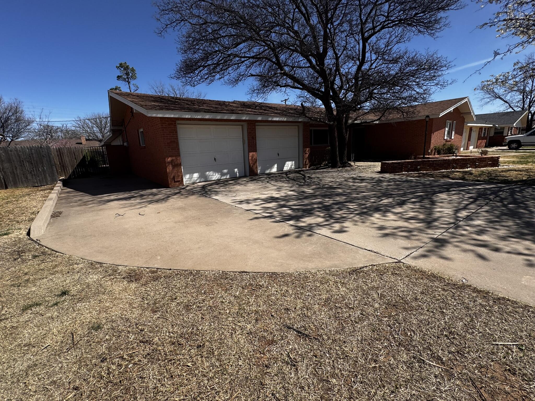 1304 Floydada Plainview, TX 79072 - Photo 4 of 49 a view of a house with a yard