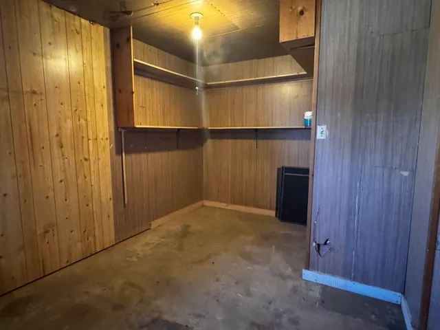 a room with a table and chairs