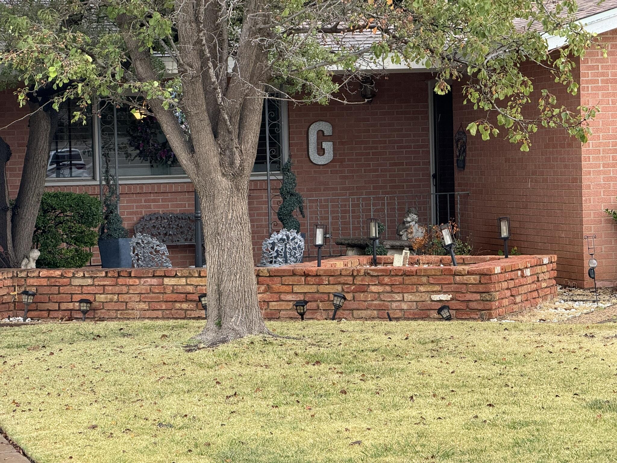 1304 Floydada Plainview, TX 79072 - Photo 6 of 49 front view of a house with a yard