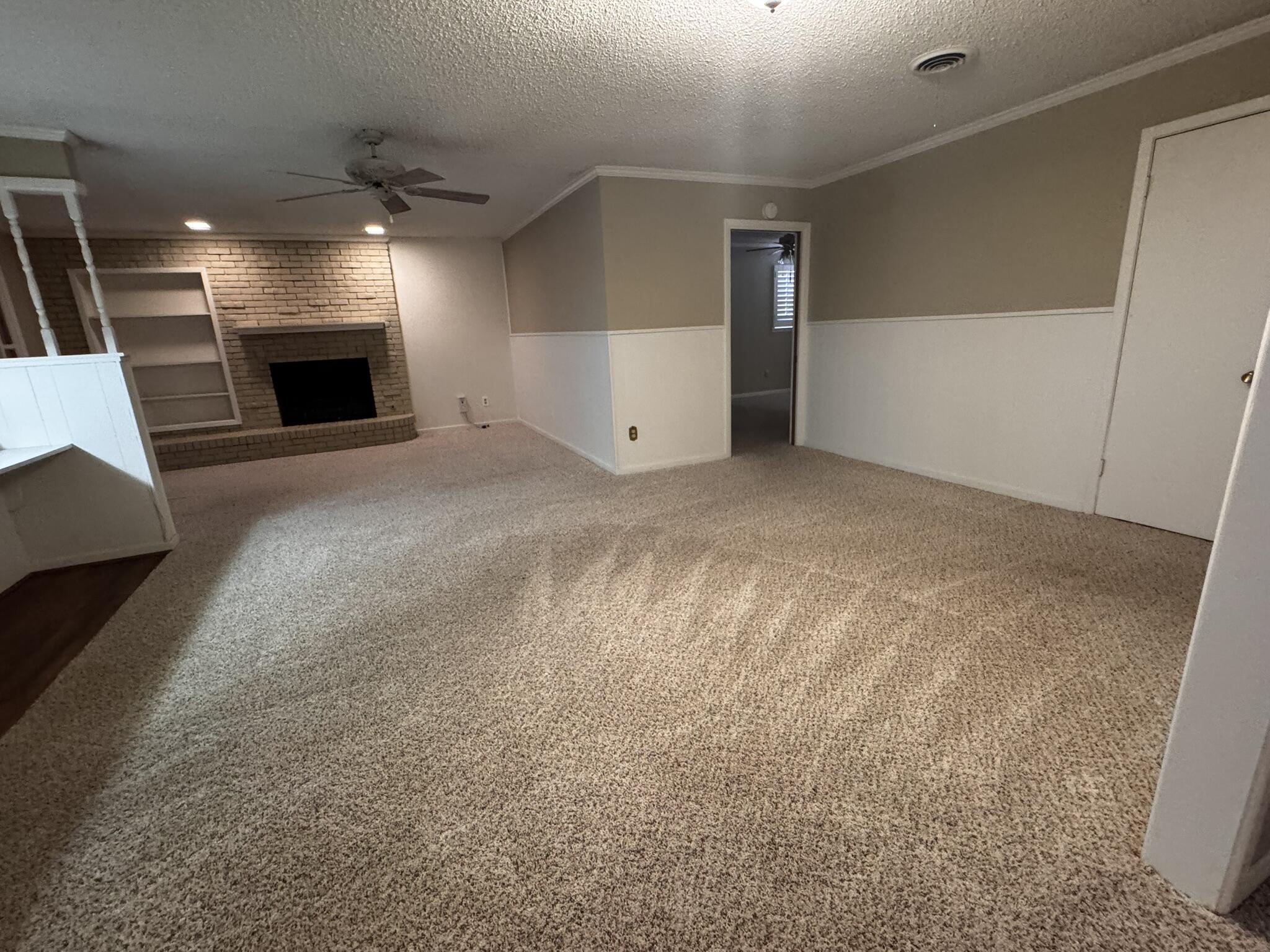 1304 Floydada Plainview, TX 79072 - Photo 10 of 49 a view of a livingroom with a fireplace