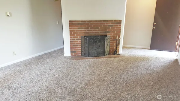 an empty room with fireplace