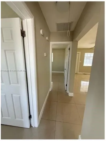 a view of a bathroom from a hallway