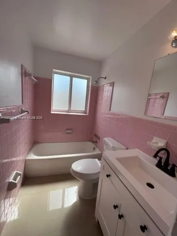 a bathroom with a sink a toilet and a bathtub