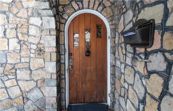 a close view of a fireplace with wooden door